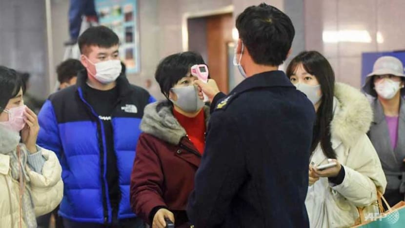 New Chinese city locked down as virus kills abroad