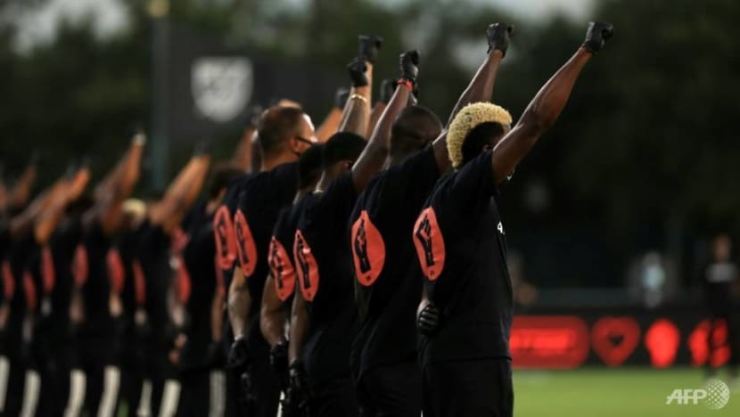 MLS backs players booed for kneeling during anthem