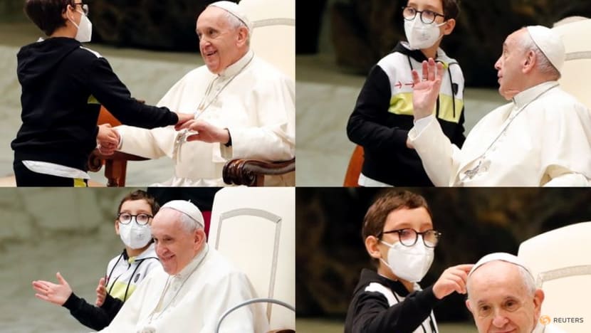 Persistent boy steals show at papal audience Persistent boy steals show at papal audience