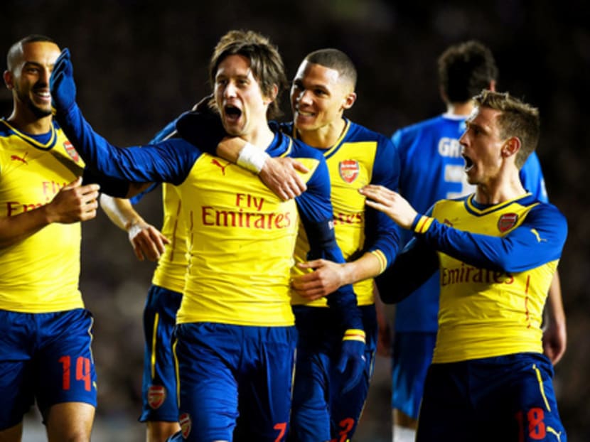 Tomas Rosicky (centre) was Arsenal’s leading man in their 3-2 victory over Brighton yesterday. Photo: Getty Images
