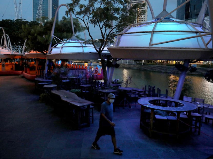 The lights were switched off at closed businesses along Clarke Quay during the circuit breaker on May 27, 2020. June 2 will mark the start of a three-phase gradual resumption of activities, with the initial phase allowing economic activities that “do not pose high risk of transmission” of the coronavirus to resume.
