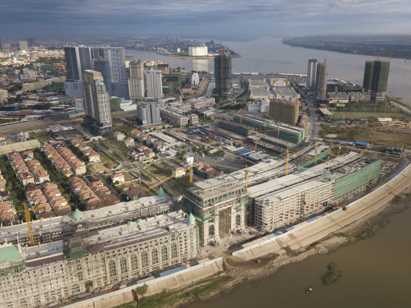 An aerial view of development projects, including a Parisian themed one, bottom, on Diamond Island in Phnom Penh, Jan. 5, 2018. Across this traditionally low-rise Cambodian capital, a building boom is becoming more noticeable, and its largest projects are often geared toward Chinese investors, who have recently taken interest in the nation’s real estate market. (Thomas Cristofoletti/The New York Times)