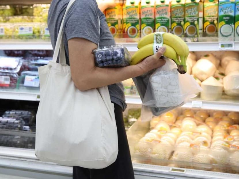 A shopper with a reusable bag at  the FairPrice Xtra outlet at Hougang One mall on Sept 16, 2019 as the 'no plastic bag' trial got under way.