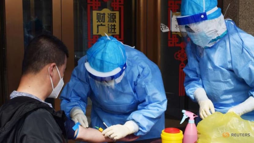 China reports 12 new coronavirus cases, 8 imported