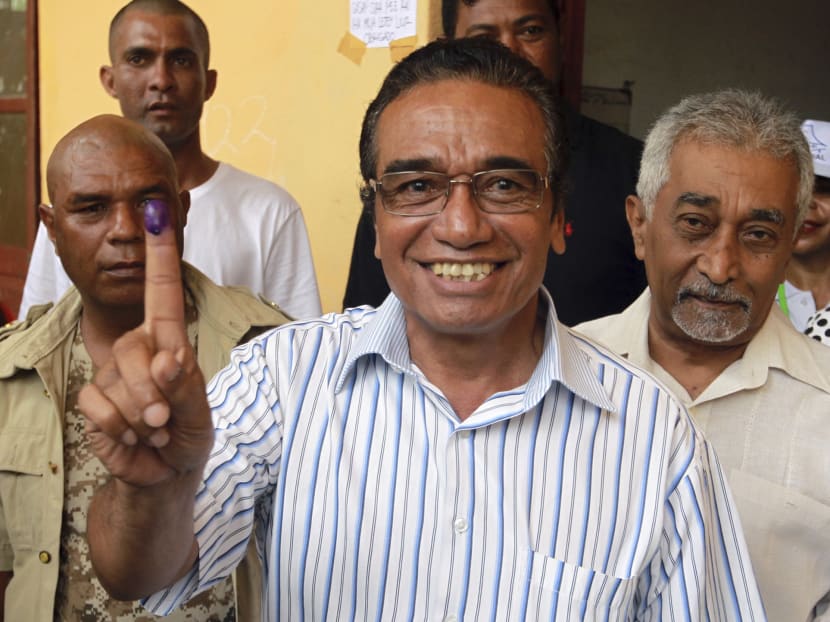Fretilin Party leader Francisco "Lu-Olo" Guterres (centre) showing his inked finger after giving his vote during the presidential election at a polling station in Dili, East Timor on March 20, 2017. Photo: AP