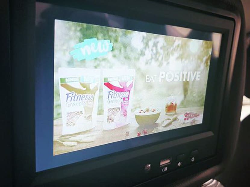 TV screens armed with USB ports that enable passengers to charge their mobile phones were installed on board 1,000 ComfortDelGro taxis in August. Photo: ComfortDelGro