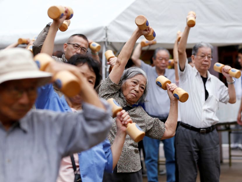 Elderly and middle-aged people exercising during a health promotion event to mark Japan’s Respect for the Aged Day in Tokyo’s Sugamo district. The pace of population decline has slowed slightly in Japan. Photo: Reuters
