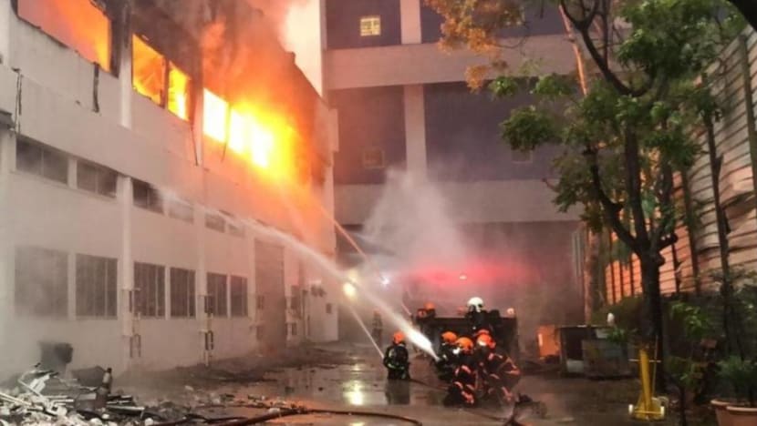 Raging fire tears through Tuas warehouse, causing walls to collapse Raging fire tears through Tuas warehouse, causing walls to collapse