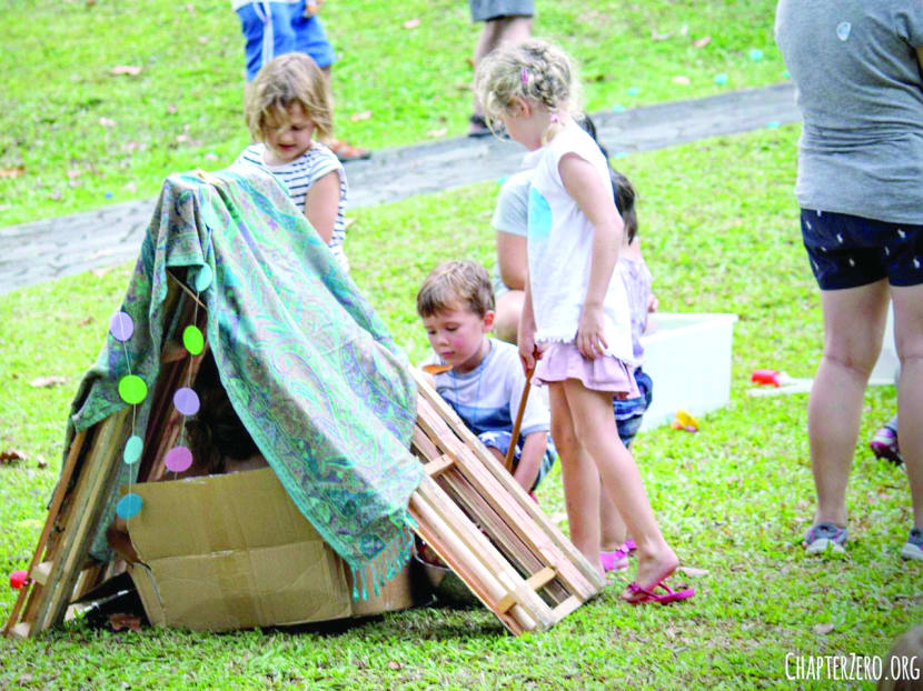 Let your children's imagination unravel by putting their creative cap on to reinvent the parts provided like tyres and cardboard boxes into toys or equipment at the pop-up playground event today. Photo: Chapter Zero Singapore