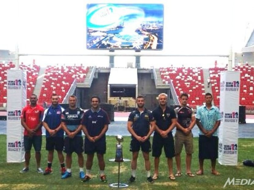 The 8 team captains posing with the trophy ahead the inaugural Rugby World Club 10s. Photo: Channel NewsAsia