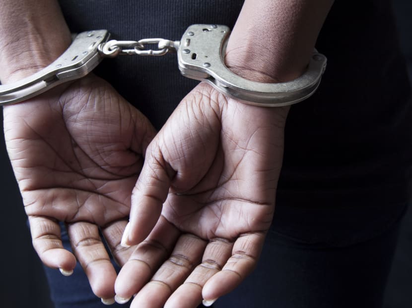 A woman in handcuffs. Photo: istock.