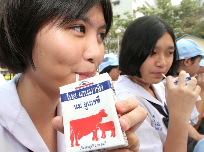 Children drink milk in a campaign to promote milk consumption. Photo Credit: Bangkok Post