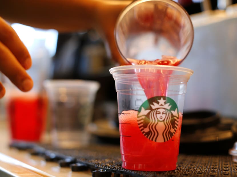 A barista pours a drink at a newly designed Starbucks coffee shop in Fountain Valley, California August 22, 2013. Photo: Reuters