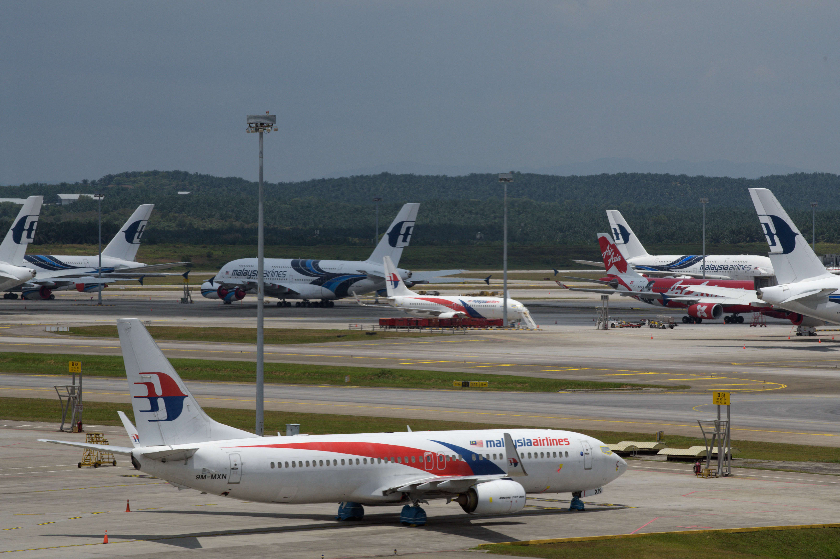 Malaysia Airlines aircraft are parked on the tarmac at Kuala Lumpur International Airport in Sepang on Sept 7, 2020,