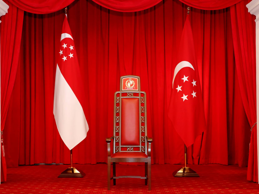 The Presidential Chair flanked by the State Flag and the Presidential Flag as seen in the Istana. Photo: TODAY