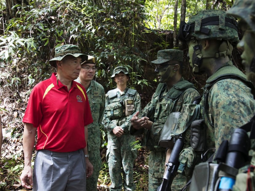 Prime Minister Lee Hsien Loong interacts with soldiers during a visit to observe jungle and survival training in Temburong. Brunei, on Oct 6, 2017. Photo: Mindef