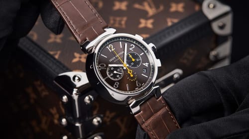 This limited edition Louis Vuitton Tambour watch comes in a special monogram trunk