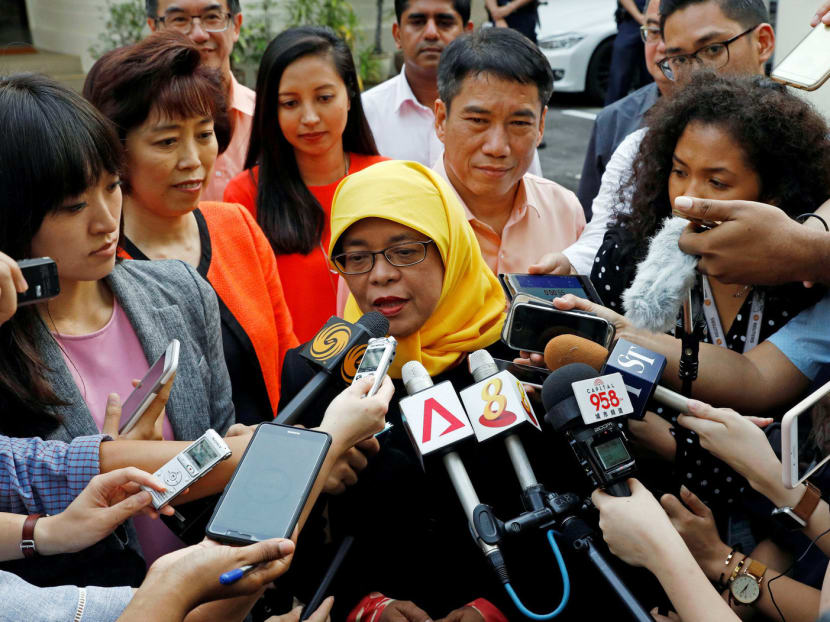 Madam Halimah Yacob at the Elections Department on Monday after. Analysts said that lowering the bar to allow a contest for the Presidential Election would affect its credibility, especially since constitutional amendments were passed recently to make the criteria more stringent. Photo: Reuters