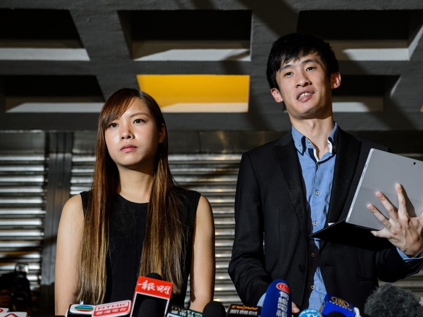 This file photo taken on Nov 15, 2016 shows pro-independence lawmakers Baggio Leung (R) and Yau Wai-ching speaking to the press outside the High Court in Hong Kong after a court ruled to disqualify two pro-independence lawmakers from parliament.
 Photo: AFP