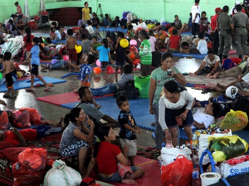 Villagers resting after being evacuated during the raised alert levels for the volcano on Mount Agung on the Indonesian resort island of Bali on Friday (Sept 22). Photo: AFP
