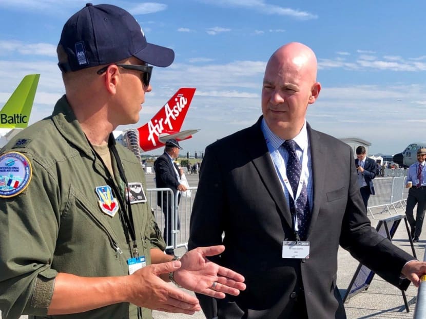 Mr R. Clarke Cooper (right) with a US Air Force pilot at a recent air show in Paris.
