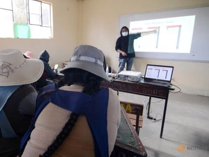 Bolivian parents go back to class to help their kids study online