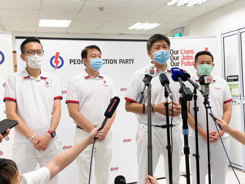 The team fielded by the People's Action Party in Sengkang Group Representation Constituency speaking to members of the media after losing to the Workers' Party.