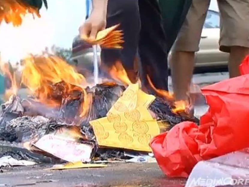 Incense paper burning. Photo: Channel NewsAsia