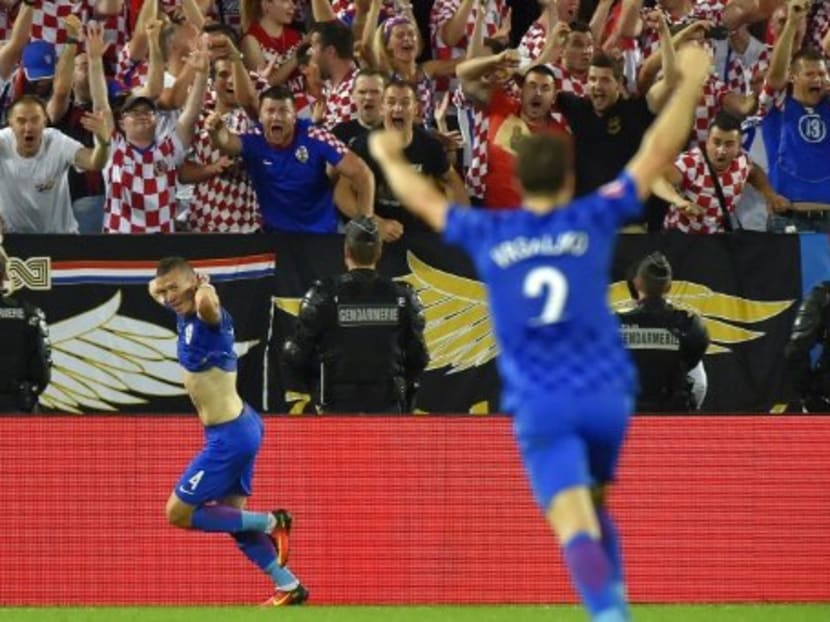 Croatia produced the performance and shock result of the third round of group stage matches when they defeated Spain 2-1 to finish top of their group. Photo: AFP