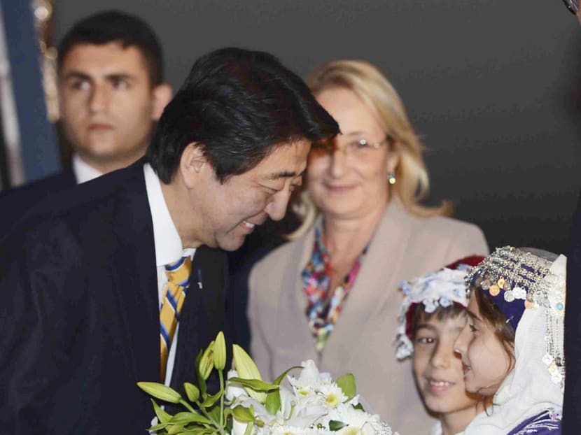Japanese Prime Minister Shinzo Abe arriving in Antalya, Turkey, on Saturday ahead of the Group of 20 summit yesterday. Photo: AP
