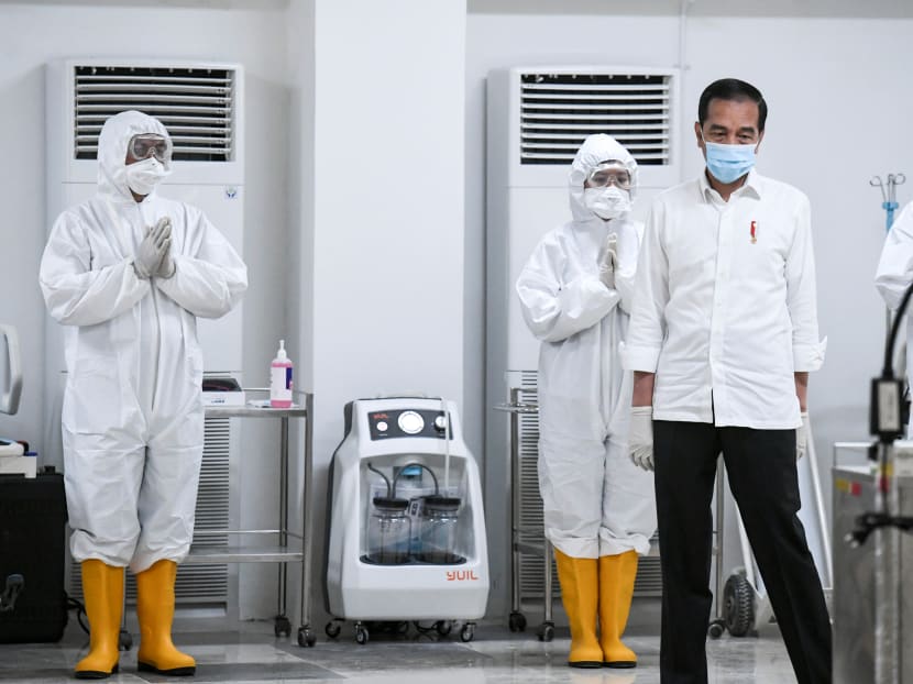 Indonesia's President Joko Widodo observes the emergency hospital handling of Covid-19 in Kemayoran Athletes Village, to prevent the spread of the virus in Jakarta, Indonesia on March 23, 2020.
