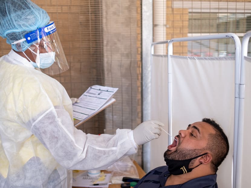 A healthcare worker conducts a PCR Covid-19 test at the Lancet laboratory in Johannesburg on Nov 30, 2021. A healthcare worker conducts a PCR Covid-19 test at the Lancet laboratory in Johannesburg on Nov 30, 2021.