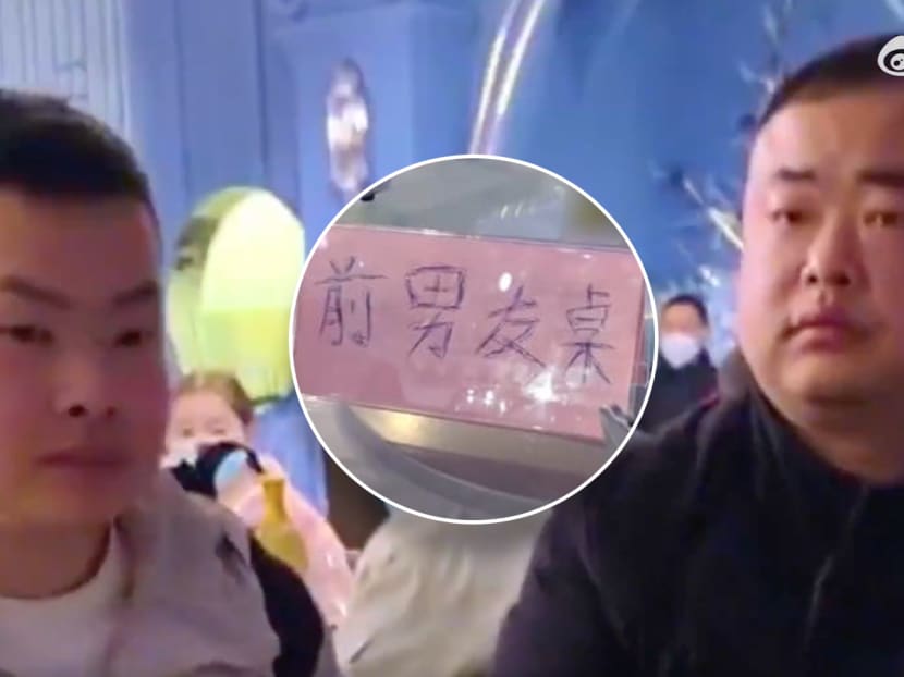A sign (centre) showing the words "table for ex-boyfriends" at a wedding banquet in Hubei, China.