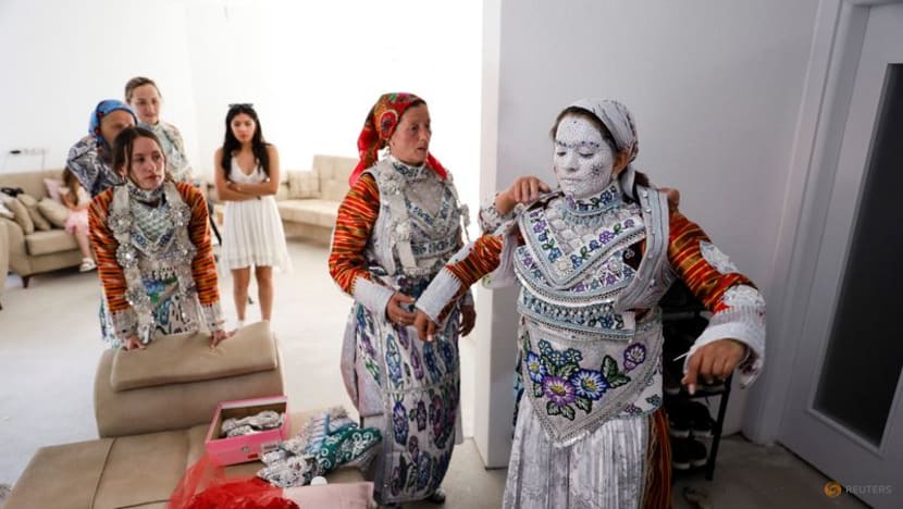 Face paint and folklore transform Chicago bride for traditional wedding in Kosovo Face paint and folklore transform Chicago bride for traditional wedding in Kosovo