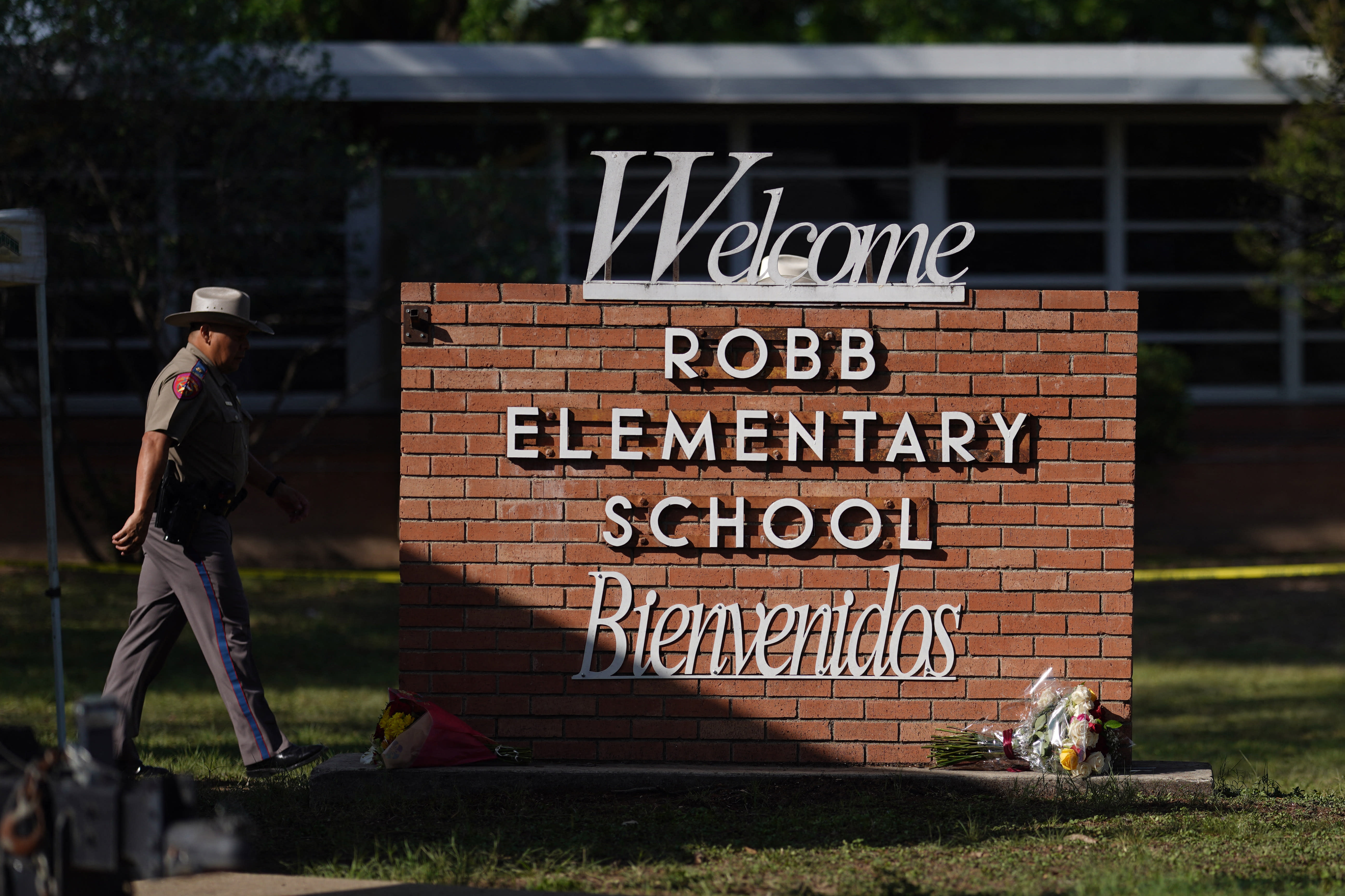 An officer walks outside of Robb Elementary School in Uvalde, Texas, on May 25, 2022.