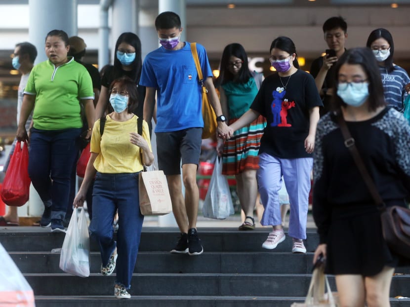 People seen donning face masks at Woodlands Civic Centre on April 3, 2020.