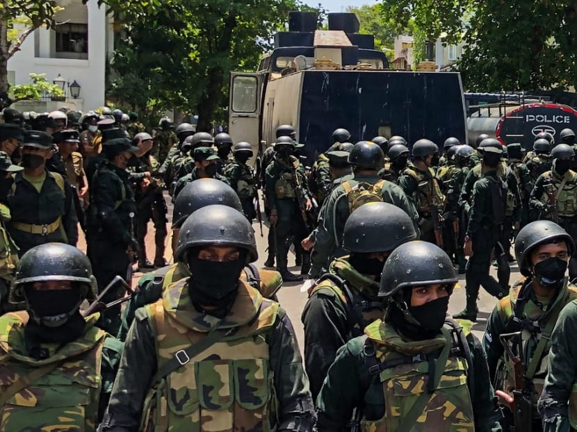 Army soldiers stand guard during an anti-government protest by demonstrators outside the office of Sri Lanka's prime minister in Colombo on July 13, 2022.&nbsp;