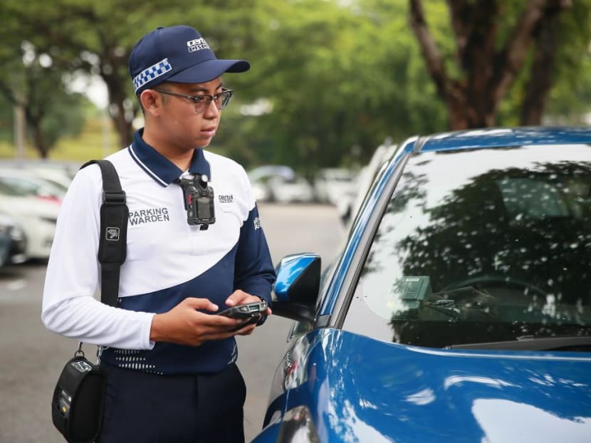 A parking warden is seen with the new uniform.