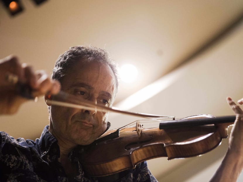 In this photo taken Wednesday, May 27, 2015, Grammy Award-winning American violinist Eugene Drucker, plays his violin during a rehearsal concert at the Music Hall in Raanana, central Israel. Photo: AP