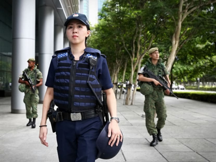 A Joint Security patrol carried out along Marina Bay Financial Centre by SPF's Ground Response Force (GRF) and SAF's Island Defence Task Force. Photo: Nuria Ling/TODAY