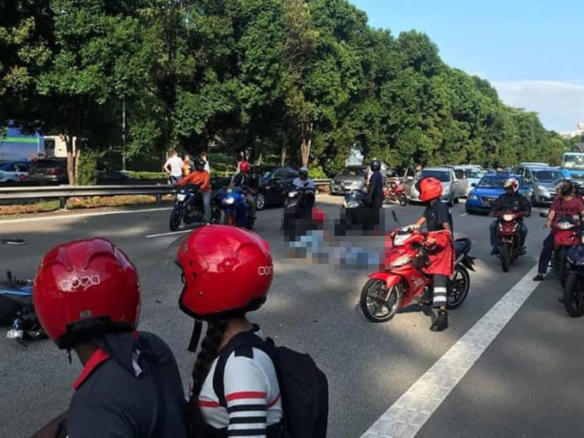 The fatal accident along the Ayer Rajah Expressway on Sept 12, 2018. The body of the motorcyclist has been blurred out.