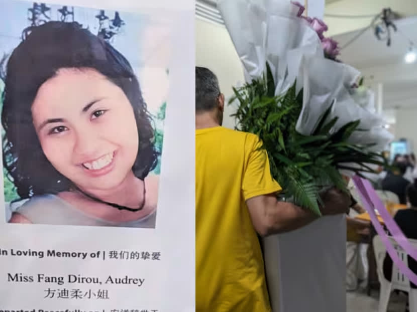 A man carrying a wreath at the funeral wake of Singaporean Audrey Fang, who was killed in Spain.