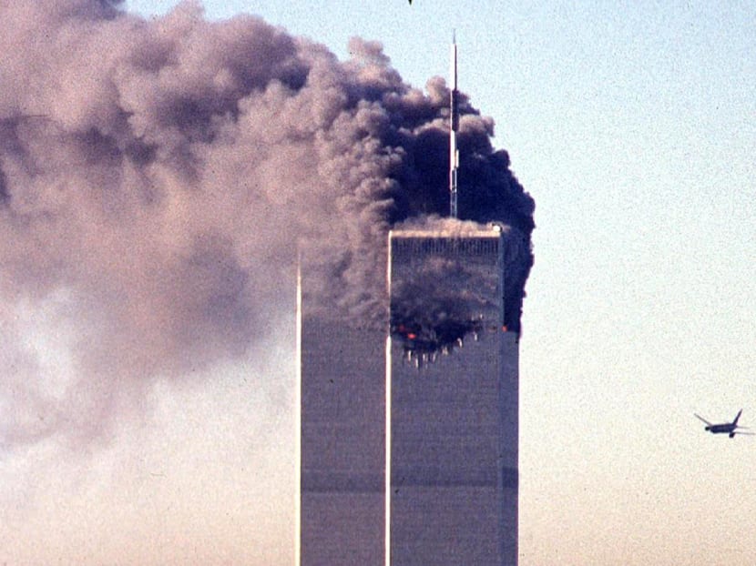 In this file photo taken on Sept 11, 2001, a hijacked commercial aircraft approaches the twin towers of the World Trade Center shortly before crashing into the landmark skyscraper in New York.
