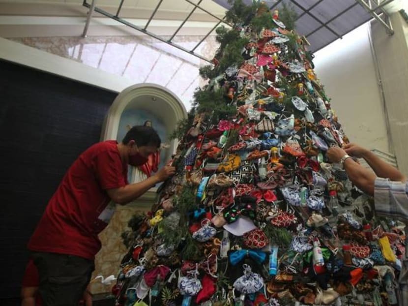 Indonesia church decorates Christmas tree with masks, sanitisers to promote COVID awareness Indonesia church decorates Christmas tree with masks, sanitisers to promote COVID awareness