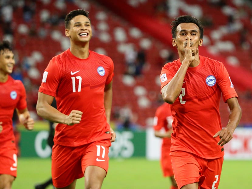 Shakir Hamzah (right) of Singapore celebrates after scoring the second goal during the AFF Suzuki Cup 2020 Group A match between Singapore and Timor Leste at the National Stadium on Dec 14, 2021. 
