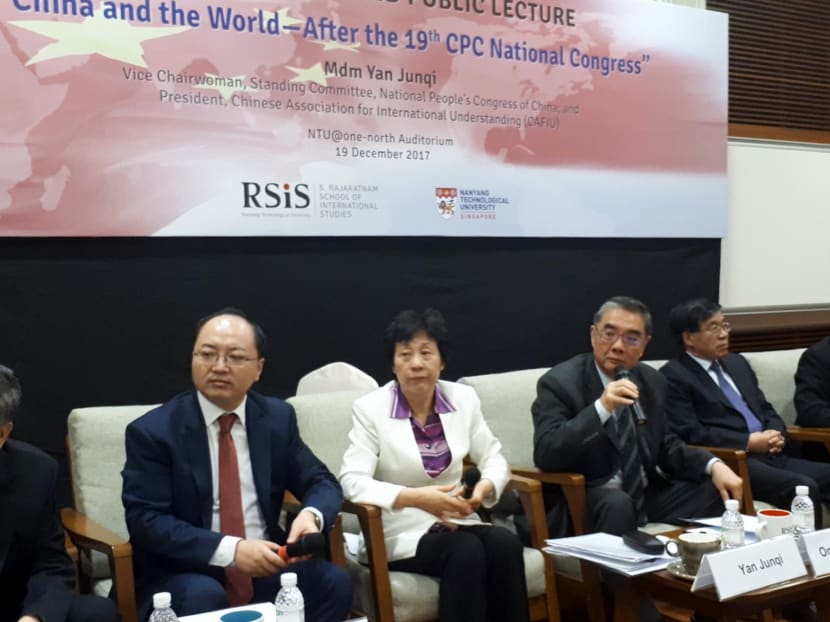 Singapore has been an important partner for China as it opened up through its reforms and engaged the international community, says Madam Yan Junqi, Vice Chairman of the National People’s Congress. Seen here with her at the forum are Singapore's Ambassador-At-Large Ong Keng Yong (holding microphone) and the Chinese Embassy's chargé d'affaires Fang Xinwen (in red tie). Photo: Jason Tan / TODAY