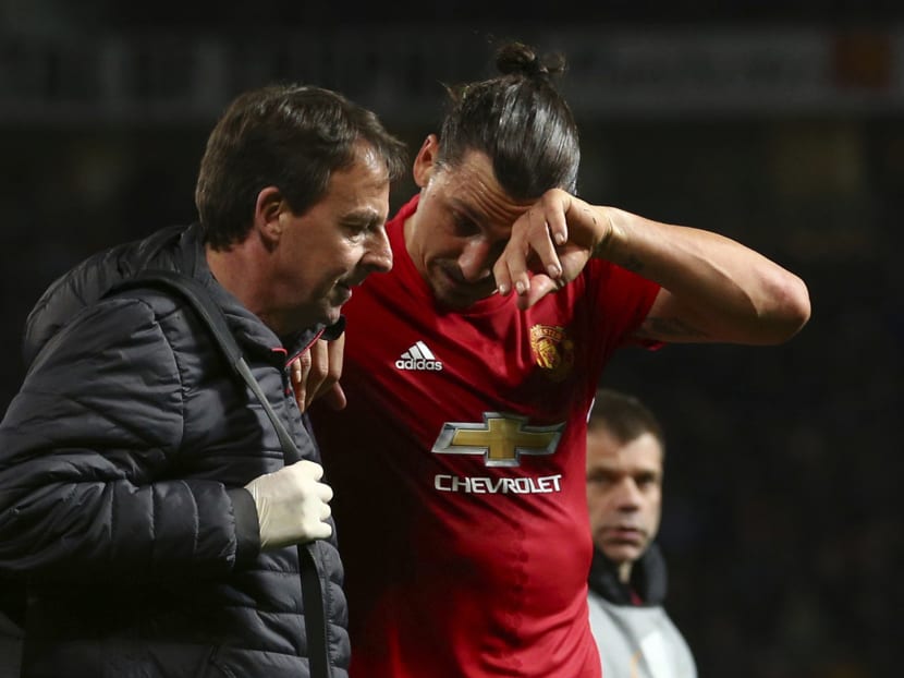 Manchester United's Zlatan Ibrahimovic leaves the field with an injury during the Europa League quarterfinal second leg soccer match between Manchester United and Anderlecht at Old Trafford stadium, in Manchester. Photo: AP