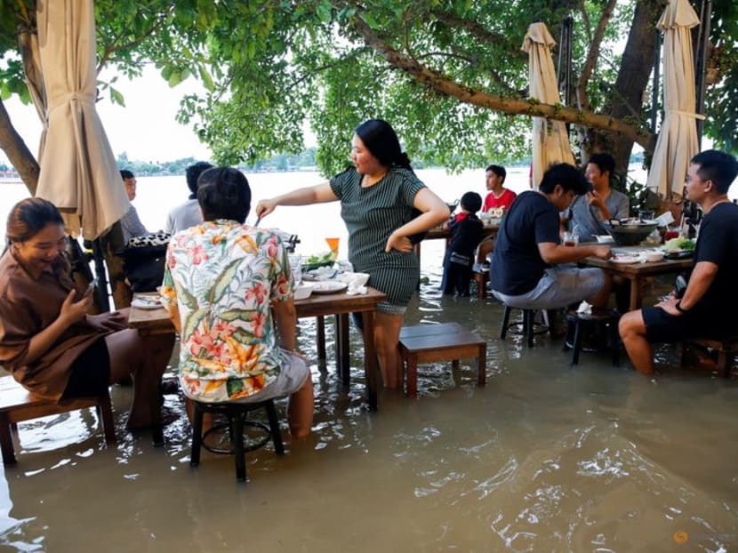 Riverside restaurant makes waves in Thailand as flood dining goes viral