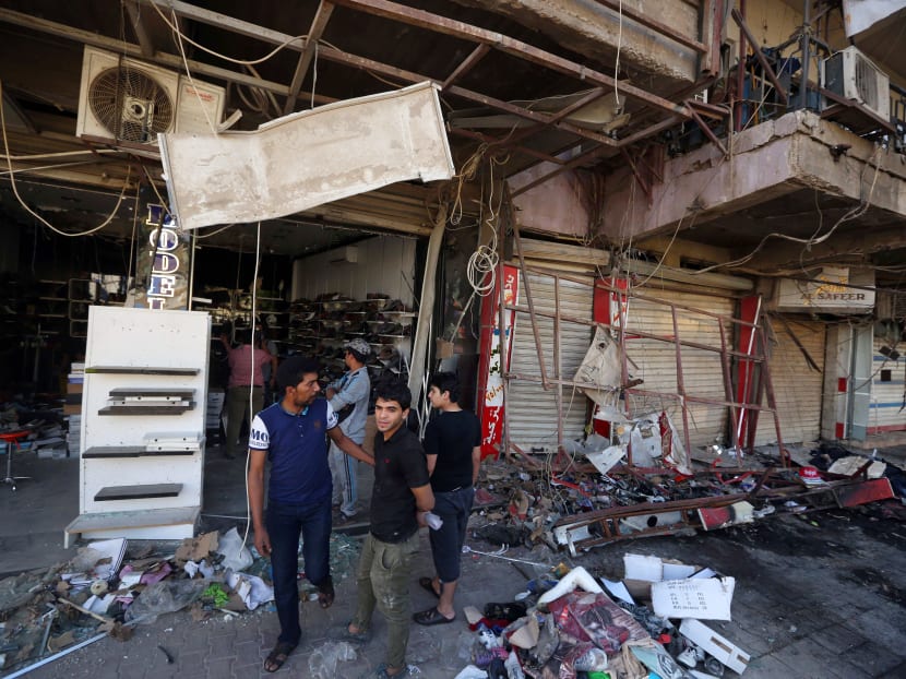 Gallery: IS group claims Iraq car bomb attack that killed 19