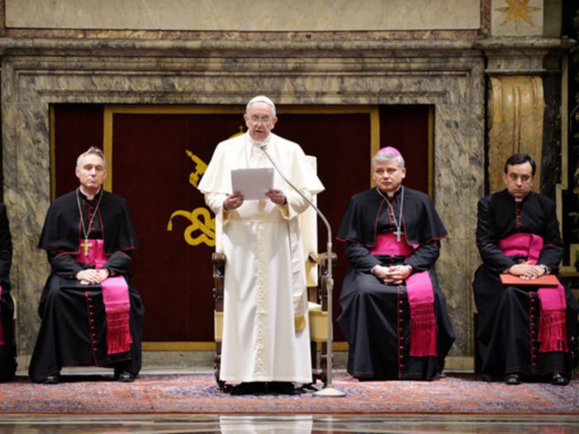 The annual Christmas greeting comes at a tense time for the Curia and few were smiling as Pope Francis (centre) issued a blistering critique yesterday of the Vatican bureaucracy. 
Photo: Reuters